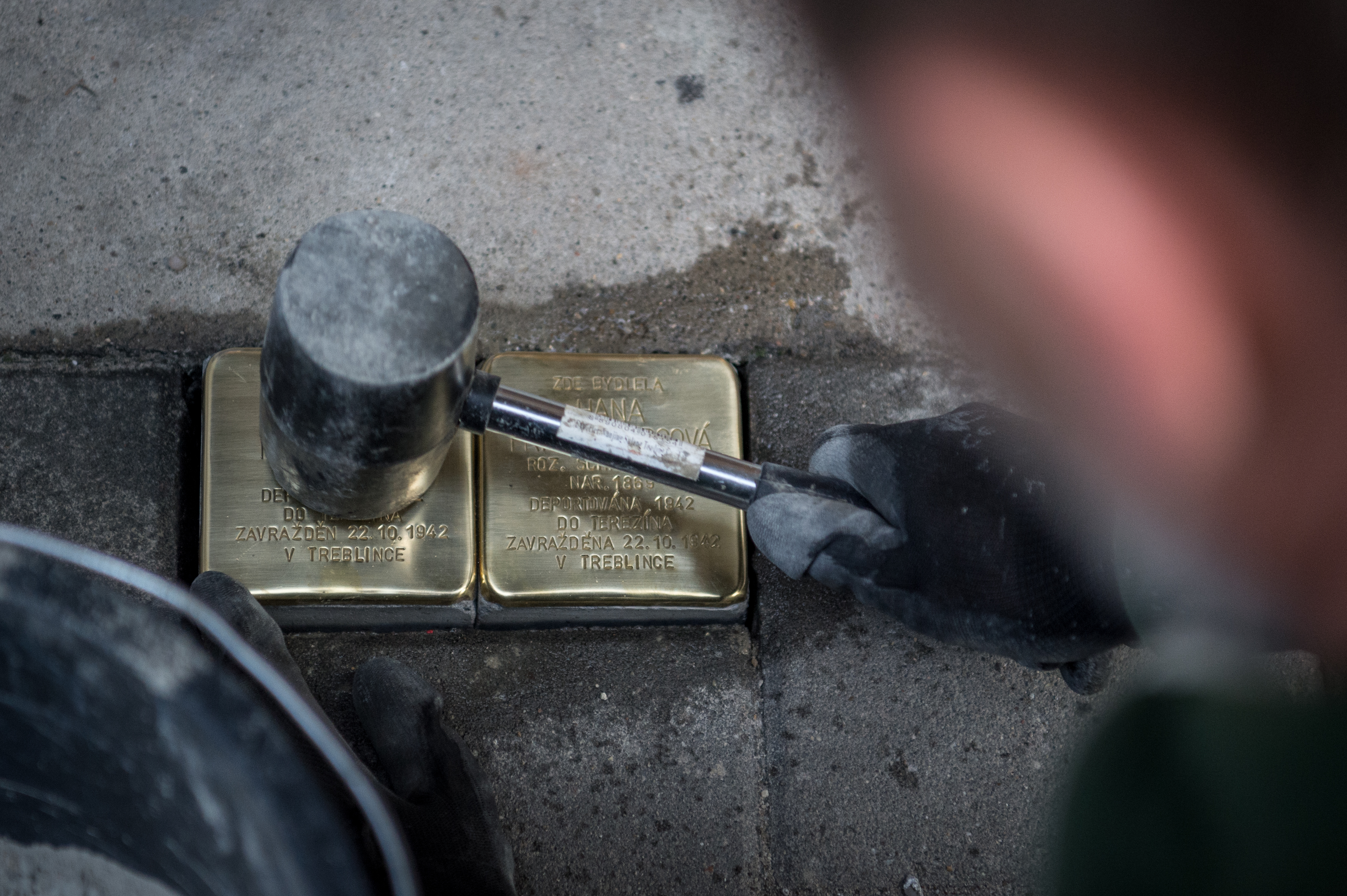 Laying two of the new cobbles. Photograph: Lukáš Kaboň