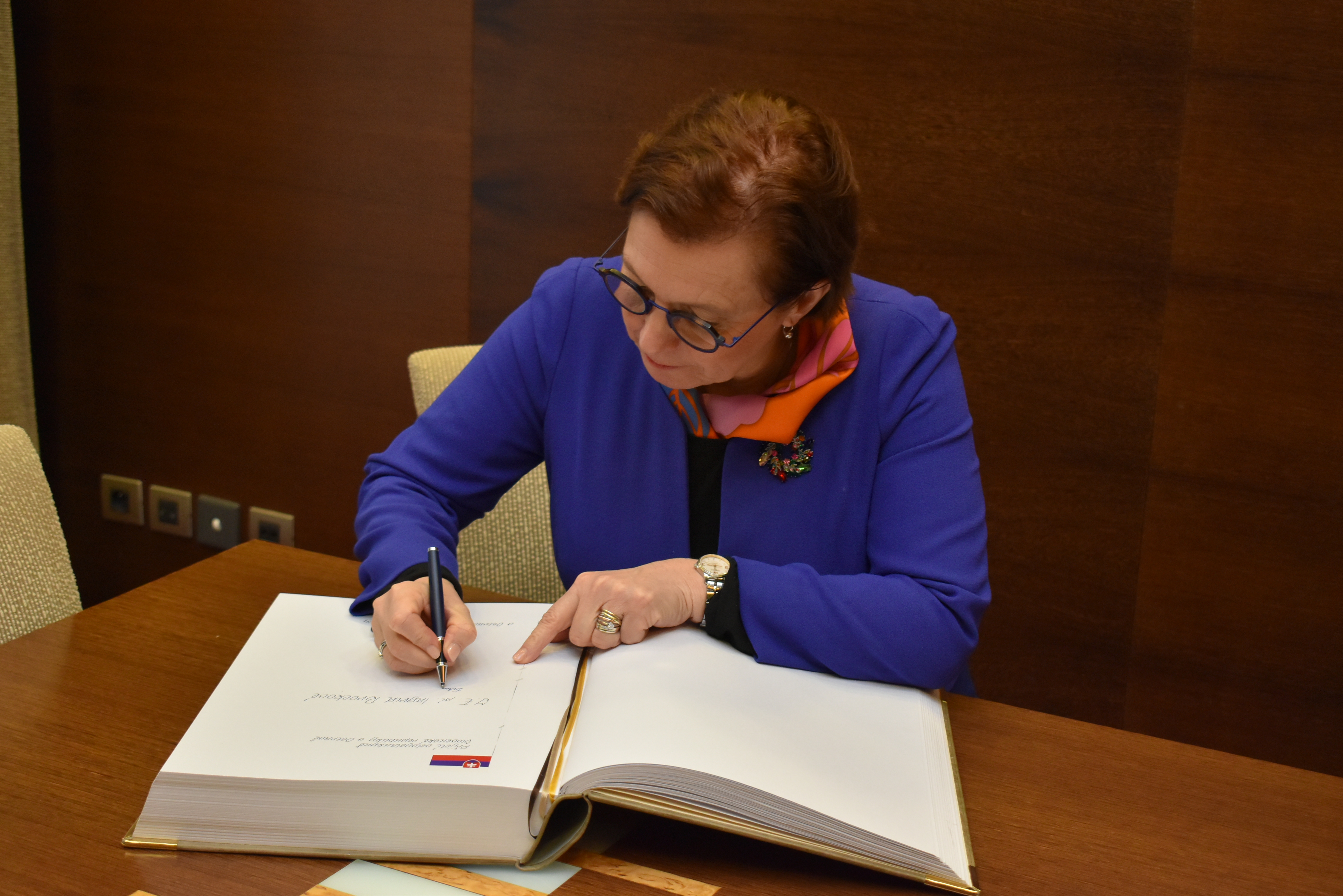 The Slovak Ambassador Ingrid Brocková signing the official visitors' book at the New City Hall. Photograph: Ostrava City Authority